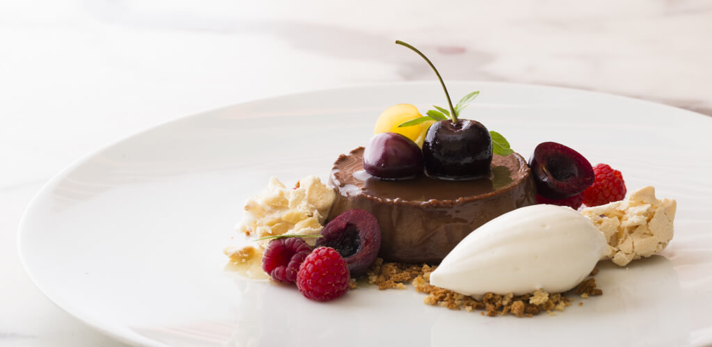 chocolate dessert with a scoop of vanilla gelato